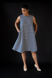 George tent dress sewing pattern. Designed by an independent pattern company. View B is collarless and sleeveless. Sample is made with blue and white striped knit jersey. Front view.