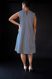George tent dress sewing pattern. Designed by an independent pattern company. View B is collarless and sleeveless. Sample is made with blue and white striped knit jersey. Back view.